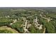 Aerial view of the neighborhood featuring houses surrounded by lush trees and winding streets at 84 Conner Glenn Dr, Hiram, GA 30141