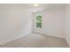 Neutral bedroom with a large window and neutral carpet at 84 Conner Glenn Dr, Hiram, GA 30141