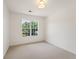 Bright bedroom featuring a large window and neutral carpet at 84 Conner Glenn Dr, Hiram, GA 30141