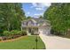 Charming two-story home with a well-maintained lawn, two-car garage, and inviting front porch at 84 Conner Glenn Dr, Hiram, GA 30141