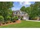 Two story house with a manicured lawn, stone accents, and a two-car garage at 84 Conner Glenn Dr, Hiram, GA 30141