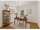 Bright office with a wooden desk, bookshelf, and cozy decor at 84 Conner Glenn Dr, Hiram, GA 30141