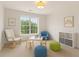 Bright room with a table, chair, armchair, storage, and decor at 84 Conner Glenn Dr, Hiram, GA 30141