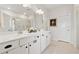 Bright bathroom with double sink vanity, white cabinets, and large mirror at 1061 Towne Mill Xing, Canton, GA 30114