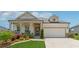 Charming single-Gathering home with a manicured lawn, covered porch, and two-car garage at 1061 Towne Mill Xing, Canton, GA 30114