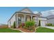 Charming single-Gathering home with a manicured lawn, covered porch, and a lovely garden at 1061 Towne Mill Xing, Canton, GA 30114