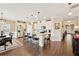 Open kitchen with white cabinets, island with seating, and stainless steel appliances at 1061 Towne Mill Xing, Canton, GA 30114