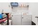 Practical laundry room with modern washer and dryer units and storage solutions at 1061 Towne Mill Xing, Canton, GA 30114