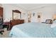 Bright main bedroom with neutral carpet, tray ceiling, and wooden furniture at 1061 Towne Mill Xing, Canton, GA 30114