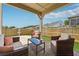 Relaxing covered patio with comfortable seating, perfect for outdoor gatherings and leisure at 1061 Towne Mill Xing, Canton, GA 30114
