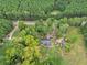 Lovely aerial view showcasing a home with a large lawn and mature trees providing privacy and shade at 1646 Highway 92 N, Fayetteville, GA 30214