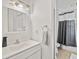 Cozy bathroom featuring modern vanity, sink, mirror, and shower at 1646 Highway 92 N, Fayetteville, GA 30214
