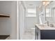 Bathroom showcasing a vanity with blue cabinets, modern fixtures, and a tiled floor at 1646 Highway 92 N, Fayetteville, GA 30214
