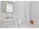 Bathroom featuring a white vanity, toilet, and tiled shower area at 1646 Highway 92 N, Fayetteville, GA 30214