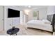 Bright bedroom with a large television and natural light at 1646 Highway 92 N, Fayetteville, GA 30214