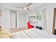 Bright bedroom with closet, desk, ceiling fan and window at 1646 Highway 92 N, Fayetteville, GA 30214