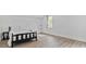 This bedroom offers modern flooring, neutral walls and a large window for natural light at 1646 Highway 92 N, Fayetteville, GA 30214