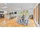Bright dining area with hardwood floors, modern lighting, and an adjacent kitchen at 1646 Highway 92 N, Fayetteville, GA 30214