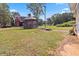 A large gazebo and barn sit in the backyard of this lovely home at 1646 Highway 92 N, Fayetteville, GA 30214