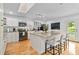 Bright kitchen features a large island with granite countertops, white cabinets, and stainless steel appliances at 1646 Highway 92 N, Fayetteville, GA 30214