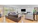 Open concept living room featuring hardwood floors, large windows, and comfortable furnishings at 1646 Highway 92 N, Fayetteville, GA 30214