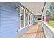 Spacious porch with views of the yard and an exterior featuring blue siding at 1646 Highway 92 N, Fayetteville, GA 30214