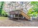 Backyard showcasing a raised deck, staircase, and yard space with privacy fence at 2922 Carriage Ln, Atlanta, GA 30349