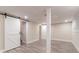 Finished basement area with neutral walls, recessed lights, and open doorway at 2922 Carriage Ln, Atlanta, GA 30349