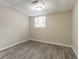 Finished basement with painted walls, modern flooring, and a bright window at 2922 Carriage Ln, Atlanta, GA 30349