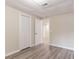 Basement showcasing painted walls and modern flooring, plus a closet and open door at 2922 Carriage Ln, Atlanta, GA 30349