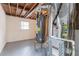 Basement utility area with exposed pipes, hot water heater, and utility equipment at 2922 Carriage Ln, Atlanta, GA 30349