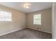 Bedroom with two windows and neutral walls offer ample natural light and closet storage at 2922 Carriage Ln, Atlanta, GA 30349