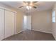 Bedroom with two closets, neutral walls, carpet, and a window offering lots of natural light at 2922 Carriage Ln, Atlanta, GA 30349
