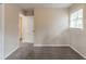 Comfortable bedroom with window, neutral walls, and an entrance to another room at 2922 Carriage Ln, Atlanta, GA 30349