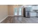 The kitchen area includes stainless steel appliances, white cabinets, and access to the back deck at 2922 Carriage Ln, Atlanta, GA 30349