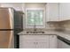 Updated kitchen showcasing stainless steel appliances, granite countertops, and ample cabinet space at 2922 Carriage Ln, Atlanta, GA 30349