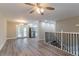 Open floor plan with hardwood floors leading to the kitchen and access to an outdoor deck at 2922 Carriage Ln, Atlanta, GA 30349