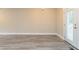 Bright living room with neutral paint, wood flooring, and door leading to outdoor at 2922 Carriage Ln, Atlanta, GA 30349