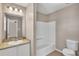 This bathroom features granite countertops and a tub and shower combo at 7120 Oakley Ct, Union City, GA 30291