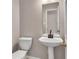Bathroom featuring a pedestal sink and toilet at 7120 Oakley Ct, Union City, GA 30291