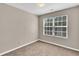 An empty bedroom featuring neutral walls, carpet and a window at 7120 Oakley Ct, Union City, GA 30291