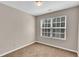 A cozy bedroom has plush carpet and a bright window at 7120 Oakley Ct, Union City, GA 30291