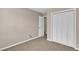 This empty bedroom boasts neutral walls, carpet and a large closet at 7120 Oakley Ct, Union City, GA 30291