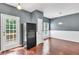 The dining area features a door to an outdoor deck and wainscoting accents at 7120 Oakley Ct, Union City, GA 30291