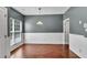 Dining area featuring hardwood floors and modern wainscoting at 7120 Oakley Ct, Union City, GA 30291