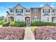 Inviting townhome featuring a well-manicured lawn and appealing architectural details at 7120 Oakley Ct, Union City, GA 30291