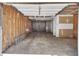 Spacious garage is unfinished with insulation and concrete floors at 7120 Oakley Ct, Union City, GA 30291