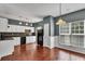 Bright kitchen with white cabinetry, stainless steel appliances, and hardwood floors at 7120 Oakley Ct, Union City, GA 30291