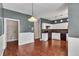 Kitchen featuring white cabinetry, dark countertops and hardwood floors at 7120 Oakley Ct, Union City, GA 30291