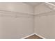 A walk-in closet features sturdy white shelving and neutral-toned walls at 7120 Oakley Ct, Union City, GA 30291